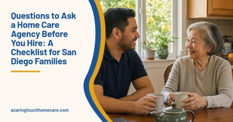 A caregiver and an older woman chat over tea at a sunny kitchen table in a San Diego home.